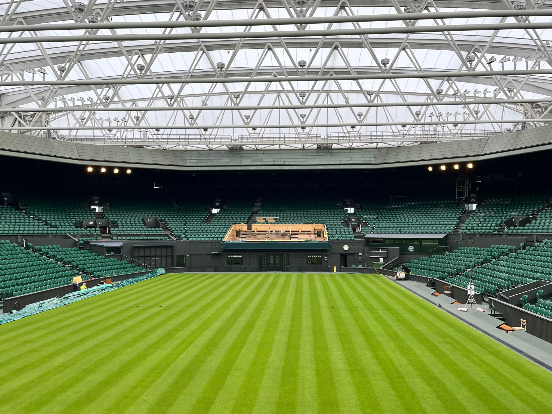 Wimbledon Centre Court interior with retractable roof and empty green seating