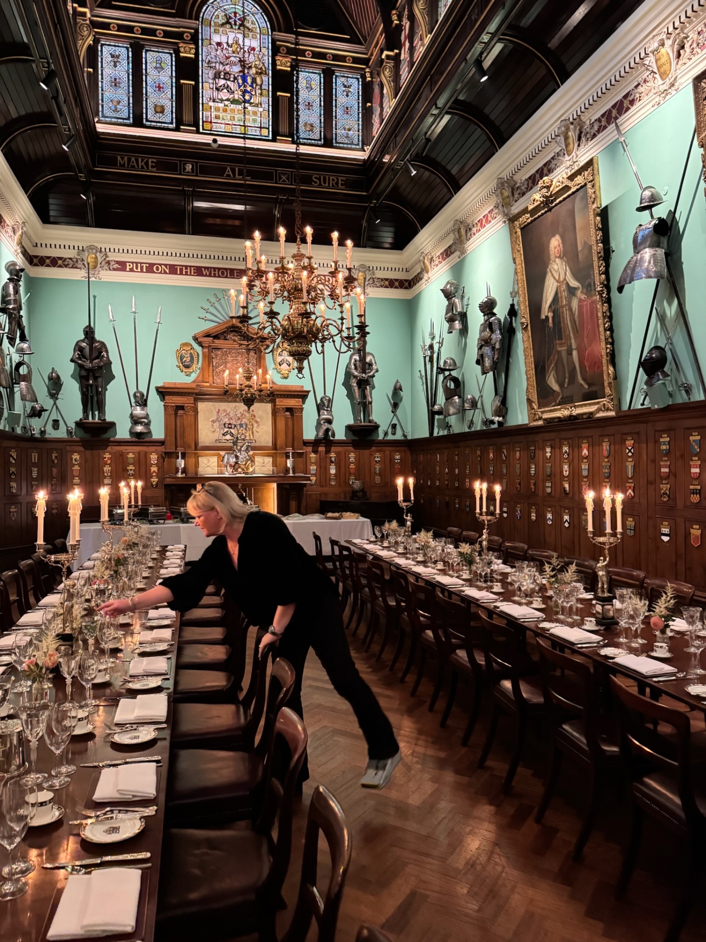 Charlie setting a long candlelit dining hall at Sandhurst